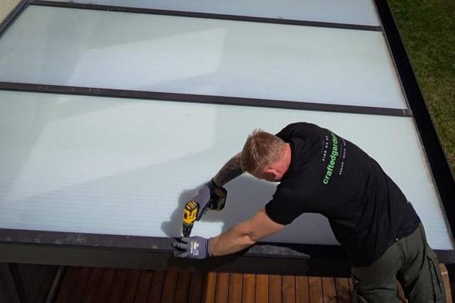 Fixing an aluminium patio cover frame against the house, aerial view