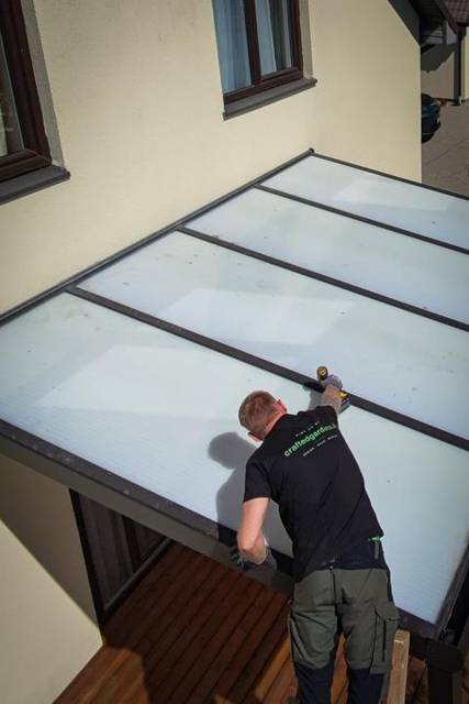 Finishing an aluminium patio cover with opal panels, aerial view