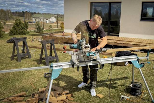 Cutting deck boards at the mitre saw on site